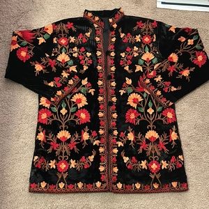 A black velvet and colored thread embroidered traditional jacket.